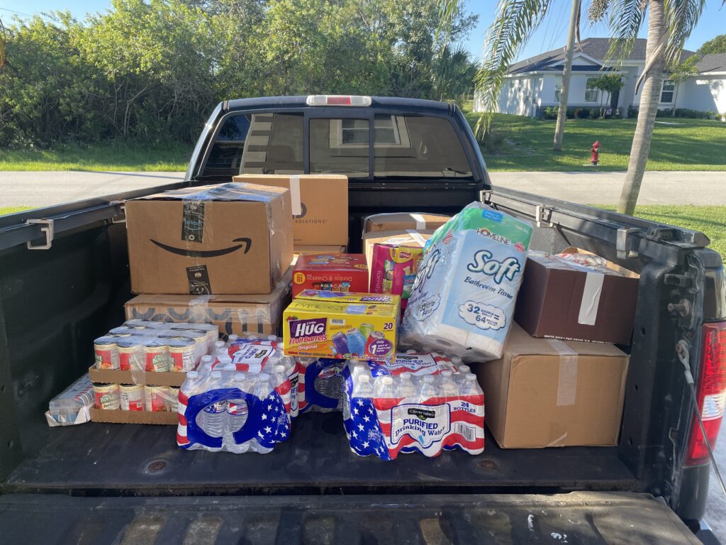 A truck with boxes and packages in the back