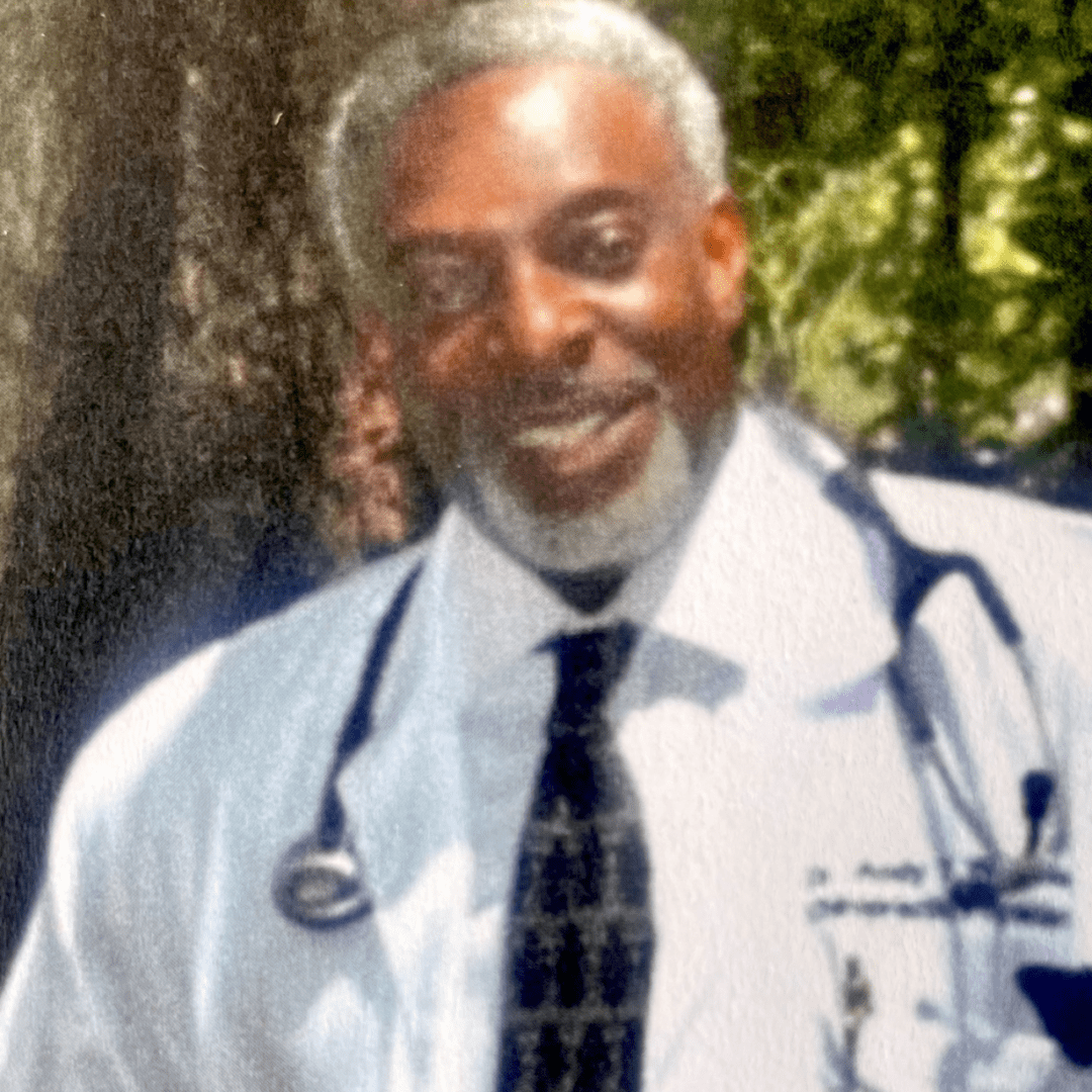 A man in white shirt and tie with stethoscope.